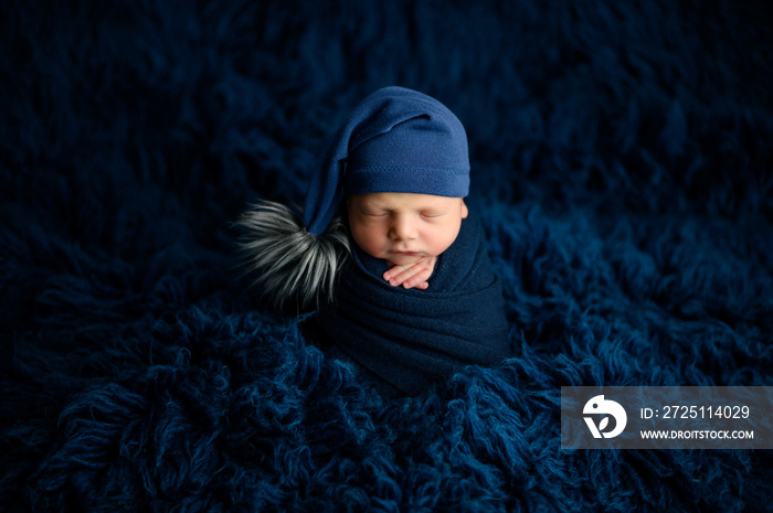 Lovely newborn baby boy sleaping in potato pose