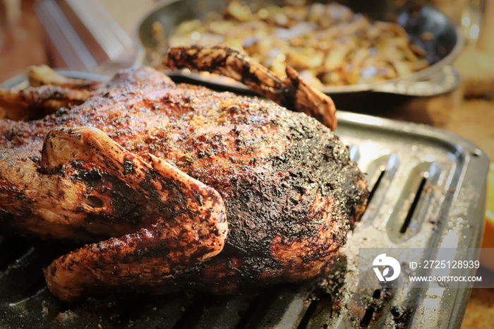 A burnt duck on a roasting pan