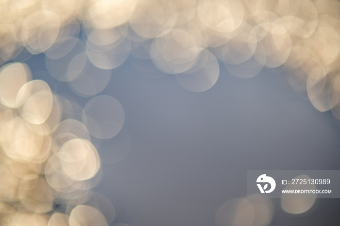 Abstract background of soft creamy bokeh circles.