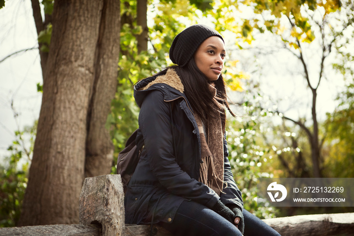 Thoughtful woman sitting in park