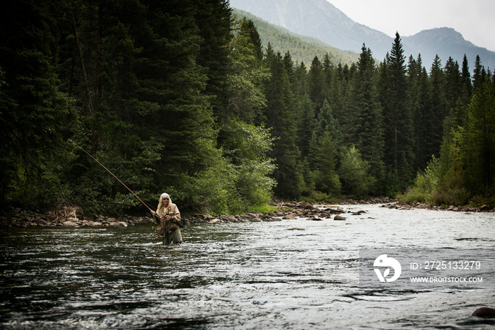 Man fishing in river outdoors