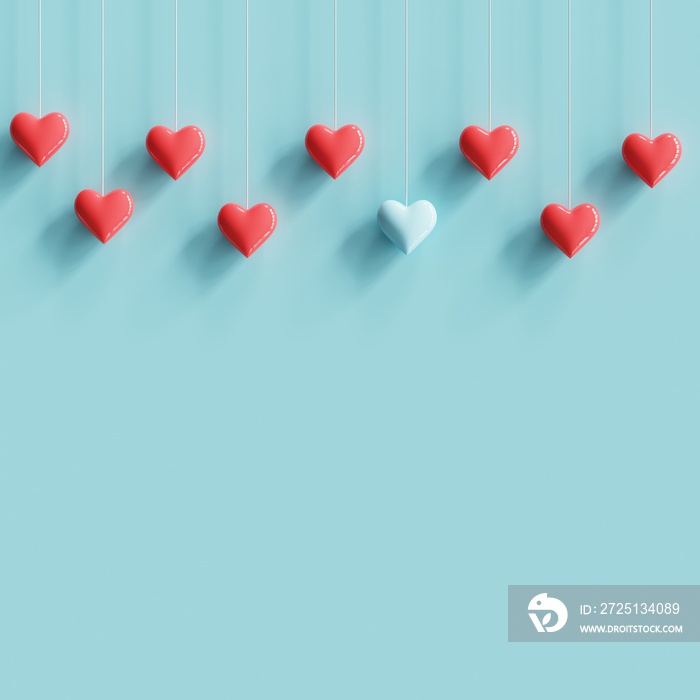 Hanging blue tiny heart contrast with many red hearts on pastel blue background. minimal concept ide