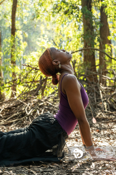 female yogi in upward dog position