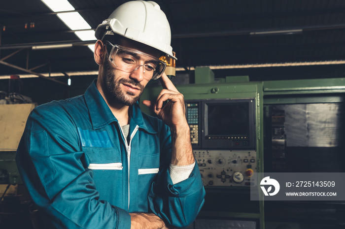 Skillful factory engineer or worker portrait while thinking and looking forward . Industrial people 