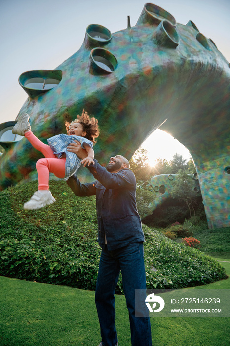 Smiling father and daughter playing in Nido de Quetzalcoatl villa