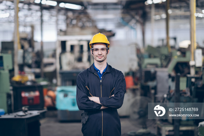 professional technician engineer standing  and arm cross in factory