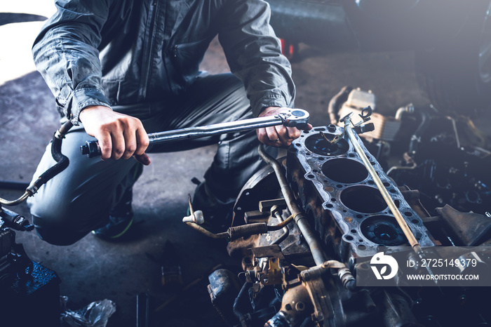 technician working on checking and service car in  workshop garage; technician repair and maintenanc