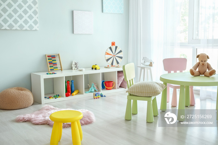 Stylish interior of modern playroom in kindergarten