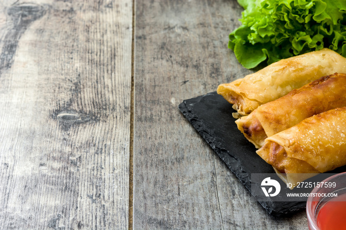 Vegetable spring rolls on wooden table background