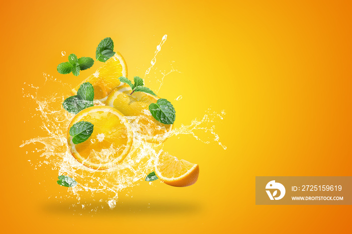 Water splashing on Fresh Sliced ​​oranges fruit on Orange background