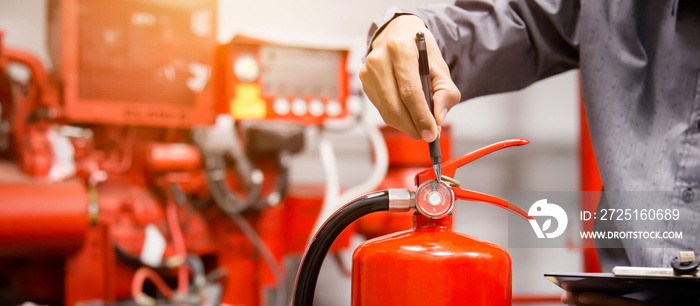 Engineer inspection Fire extinguisher in control room.