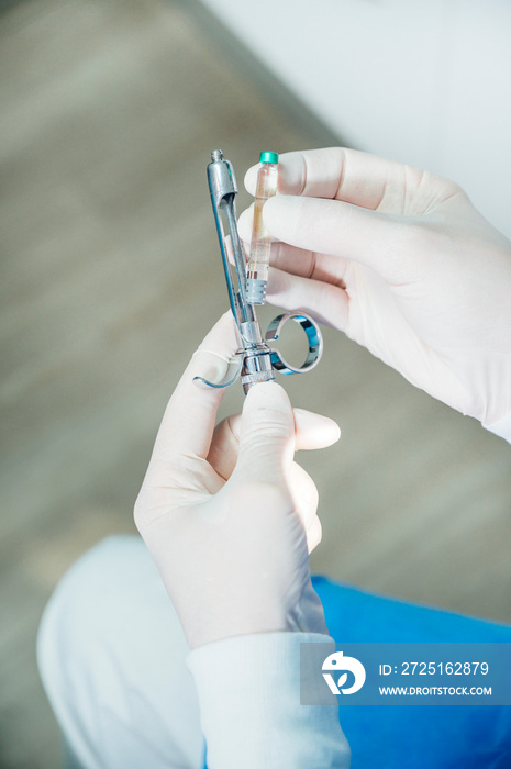 Doctor with syringe is preparing for injection. Medical concept