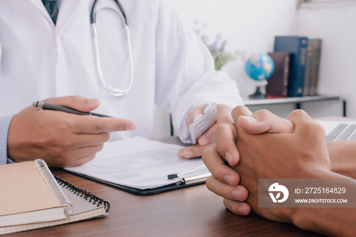 Close up of patient and doctor taking notes. healtcare and assistance concept..