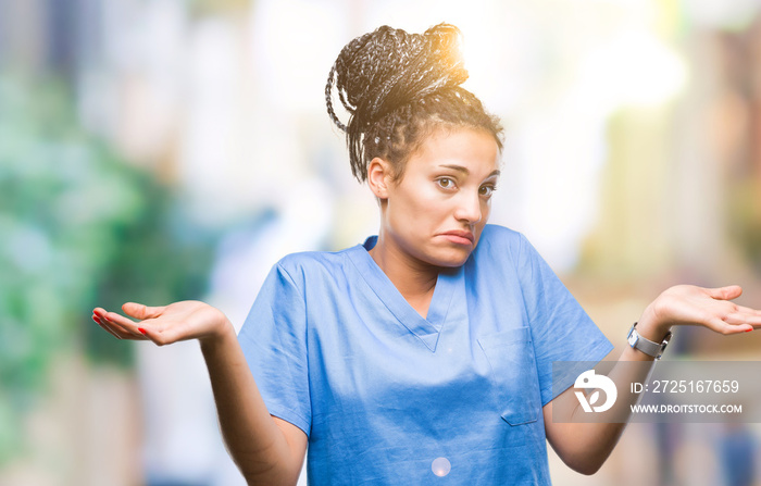 Young braided hair african american girl professional nurse over isolated background clueless and co