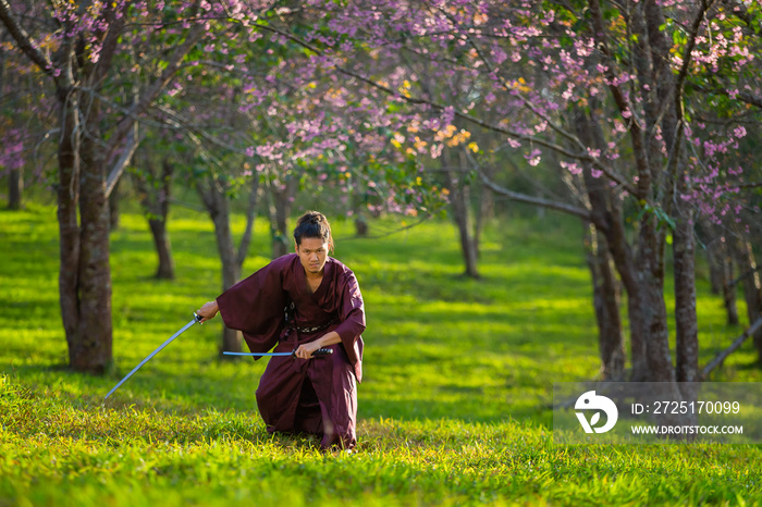 The Japanese samurai are gripping the sword, preparing to fight.