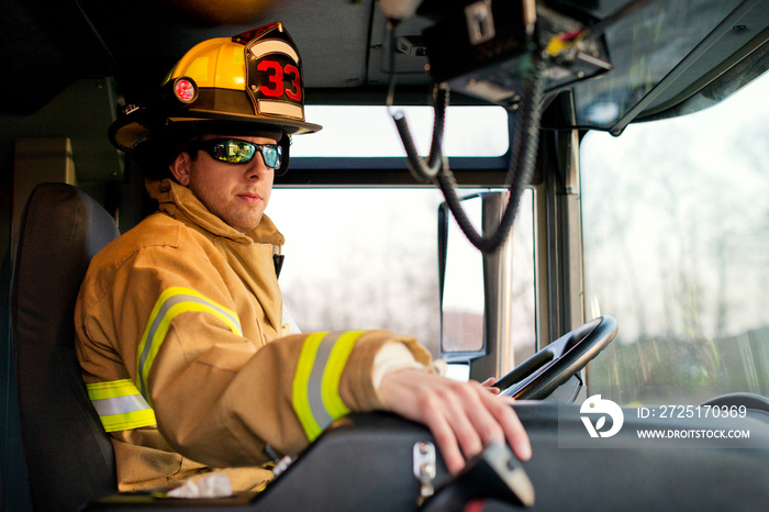 Firefighter driving fire engine