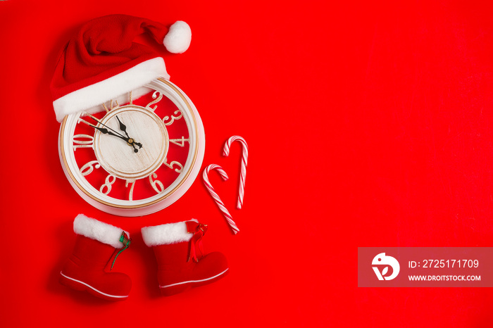 Clock in a hat with Santa Claus boots, wallpaper, New Year and Merry christmas