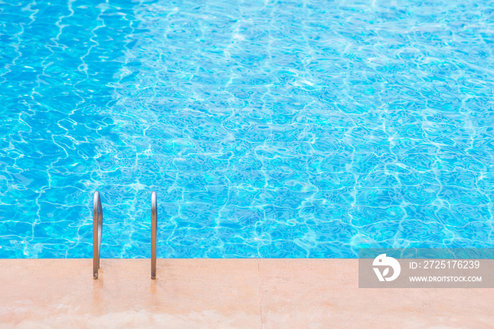 blue swimming pool at hotel with stair