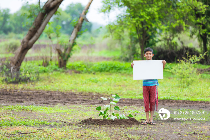 kid planting tree and showing empty board