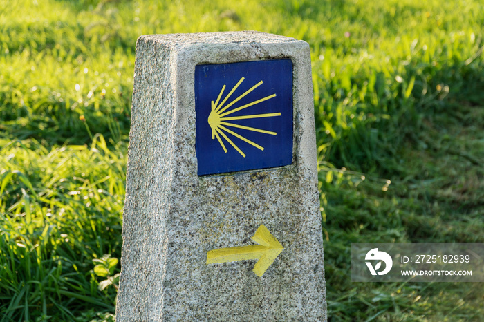 Way of St. James sign. Yellow scallop sign pilgrimage to Santiago de Compostela