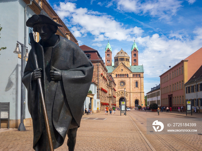 Pilgrim statue (Jakobspilger) and western facade of historic Speyer Cathedral seen from Maximilianst