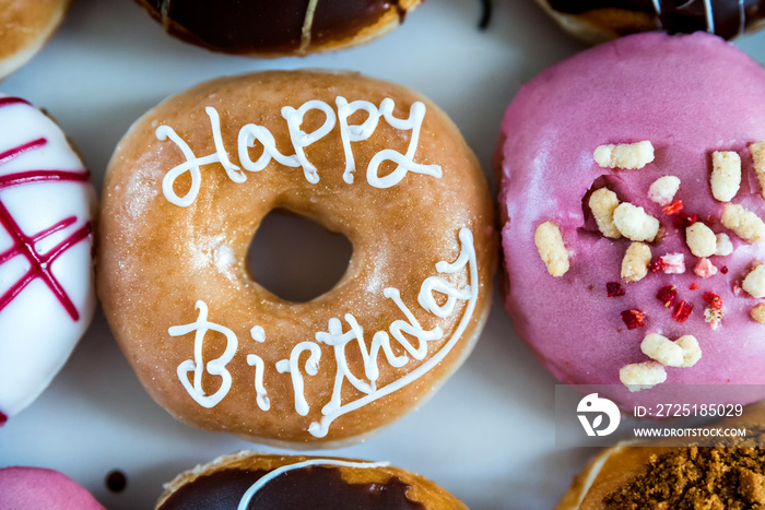 happy birthday multicoloured donuts inside white box