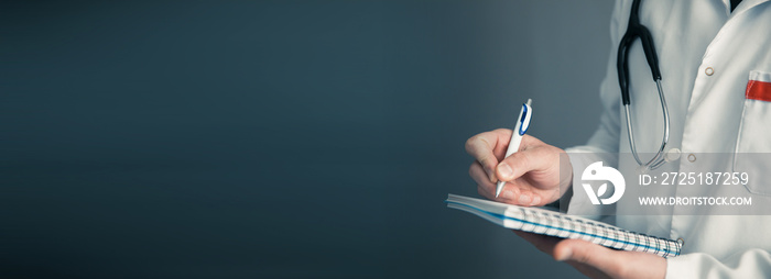 doctor holding pen with notepad