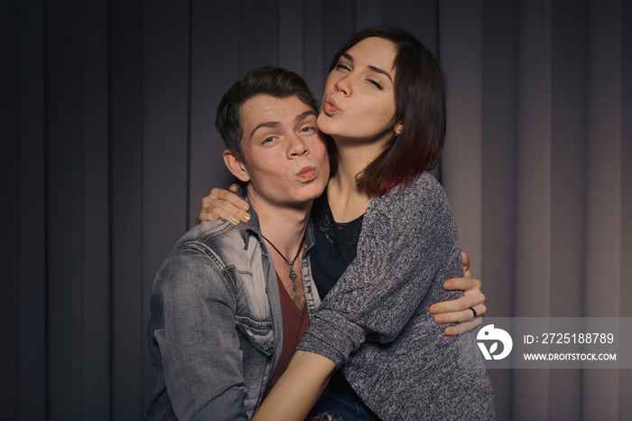 Happy couple in love in a photo booth