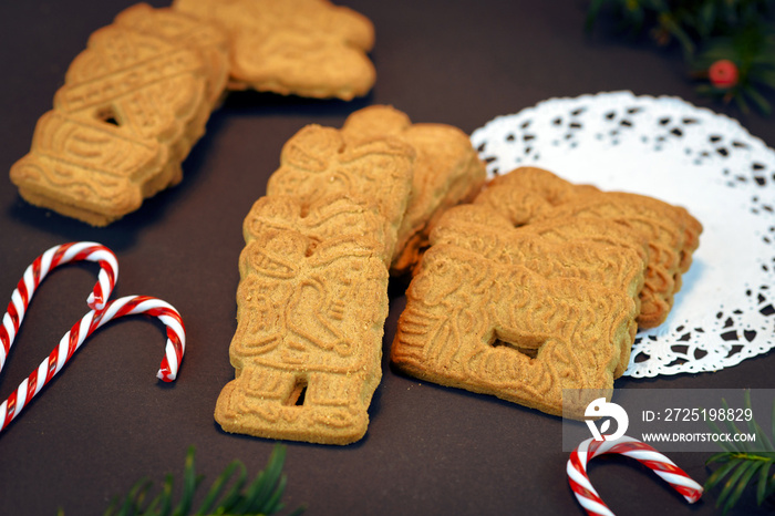 Speculaas or speculoos, a spiced thin, crunchy and caramelizedand shortcrust biscuit with figure