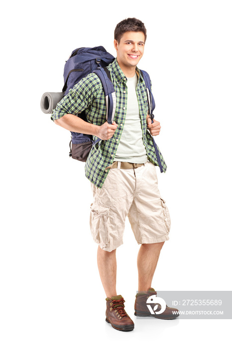 Full length portrait of a hiker with backpack posing