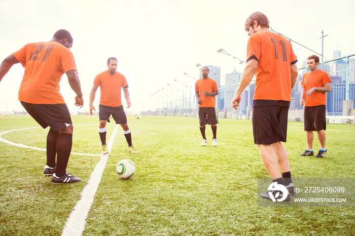 Soccer team practicing together in circle