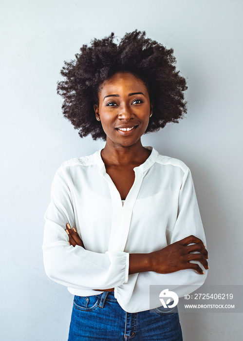 Happy smiling African American woman isolated on gray background. Closeup portrait of smiling young 