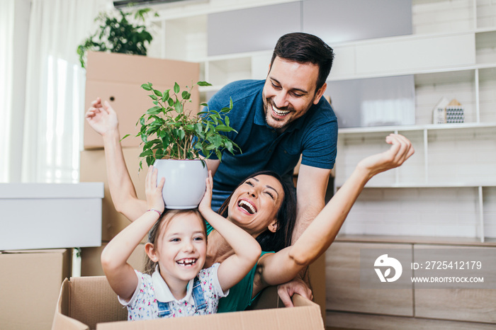 Happy family moving into their new home.