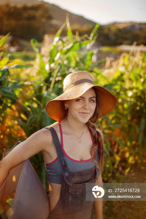 Portrait of young woman standing in field