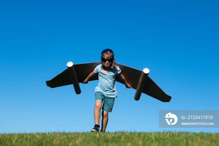 Dreams of travel. Child flying on jetpack with toy airplane on sky background. Happy child playing i