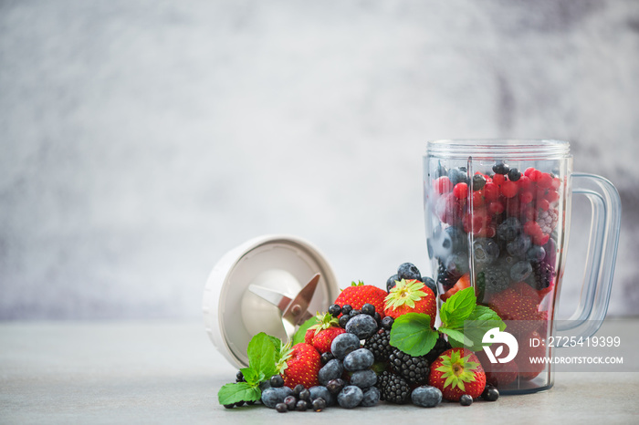 Blender full of berry fruits