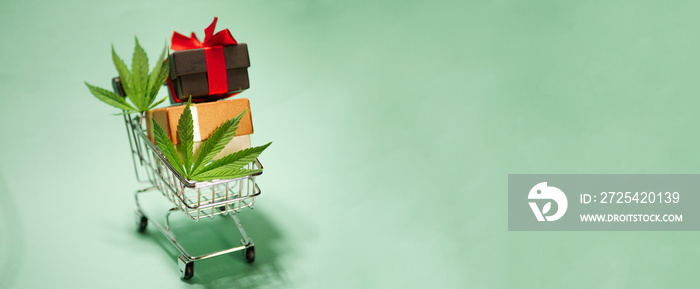 Cannabis leaf with shopping cart. Christmas gifts. New Year sale banner. Marijuana online store. Cop