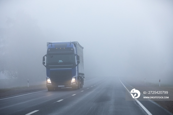 Truck on the road in the fog