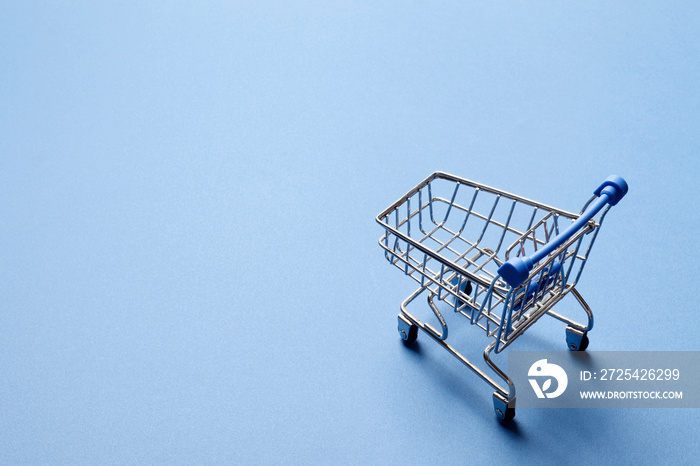 Shopping concept.  shopping cart on a blue background.