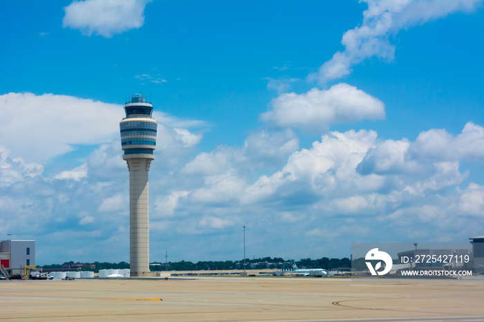 Control Tower at the Airport on Partially Cloudy Sky