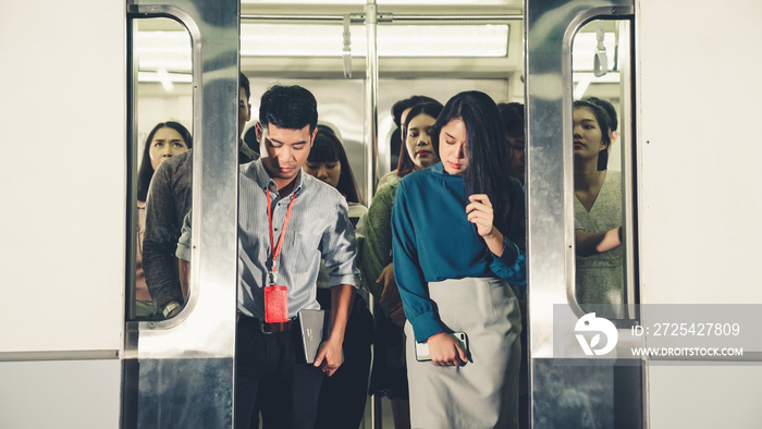 Crowd of people on a busy crowded public subway train travel . Commuting and urban lifestyle concept