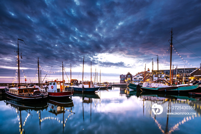 Urk village during sunset, Urk Flevoland Netherlands lighthouse and harbor lights during winter at t