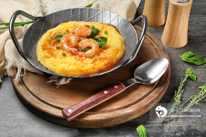 Dish with fresh tasty shrimp and grits on table