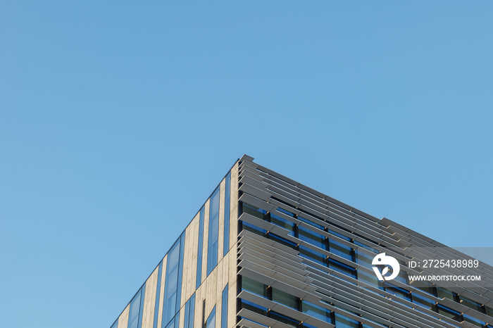 Low angle and close up detail of two different facade with 2 types of cladding panel sheet and fin f