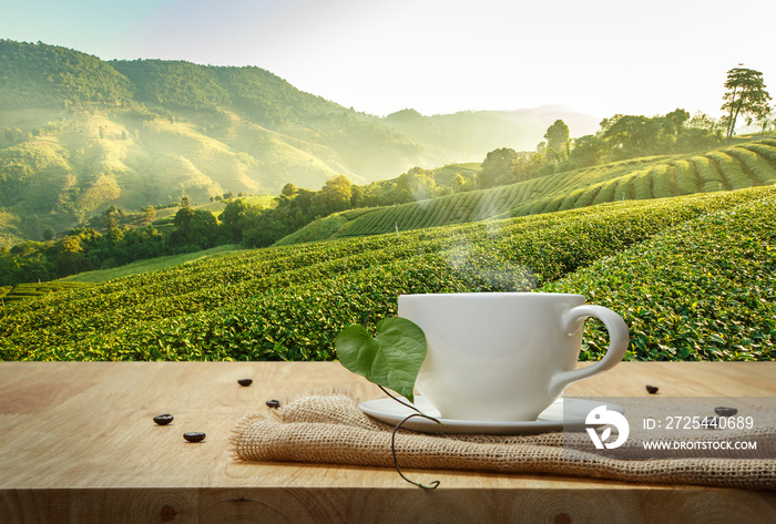 Coffee cup with sackcloth on the wooden table and the Plantation