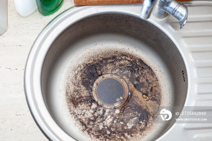 Dirty Sink at kitchen room. Clean a sink drain. unclog a kitchen sink without a disposal