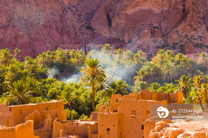 The ancient moroccan town near Tinghir with old kasbahs and high Atlas mountains in background, Ting