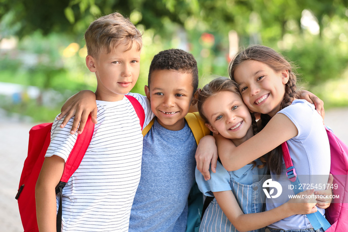 Group of cute little pupils outdoors