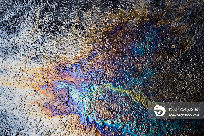 Oil stain on Asphalt road after rain