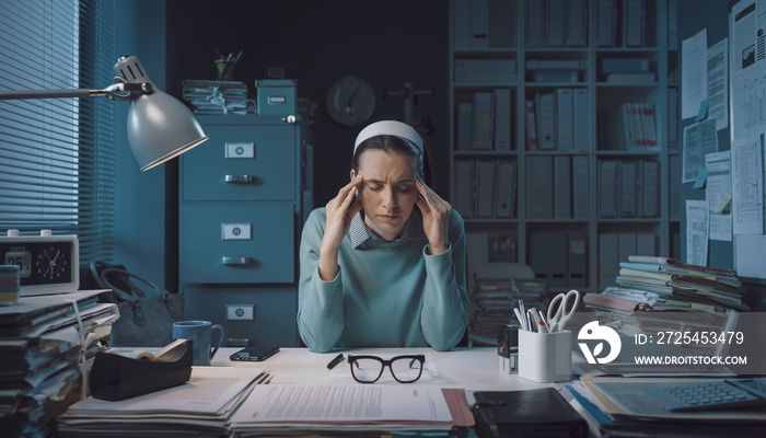 Stressed businesswoman with headache